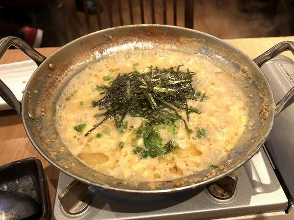 雑炊セット 460円（税別） をスープに投入したところ
